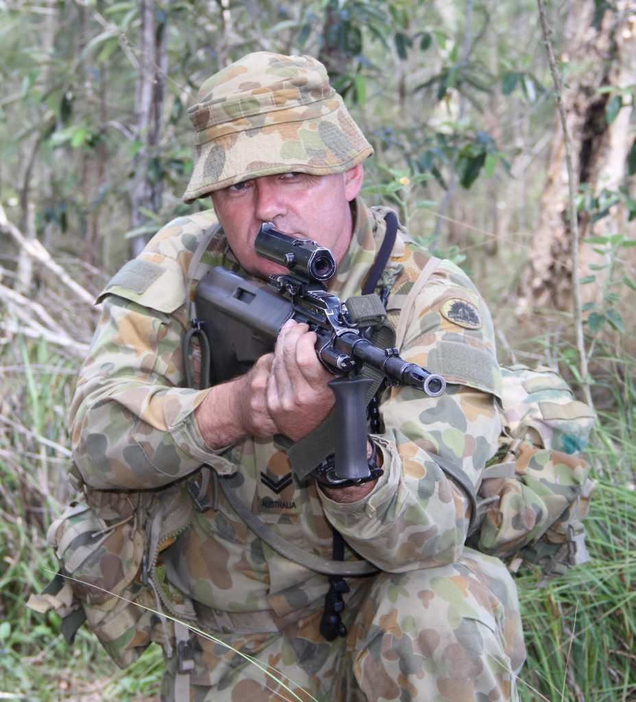 Cpl Brendan Castray takes aim during a live fire exercise. He will celebrate 11 years of military service as an Army Reservist this year. Cpl Brendan Castray takes aim during a live fire exercise. He will celebrate 11 years of military service as an Army Reservist this year.